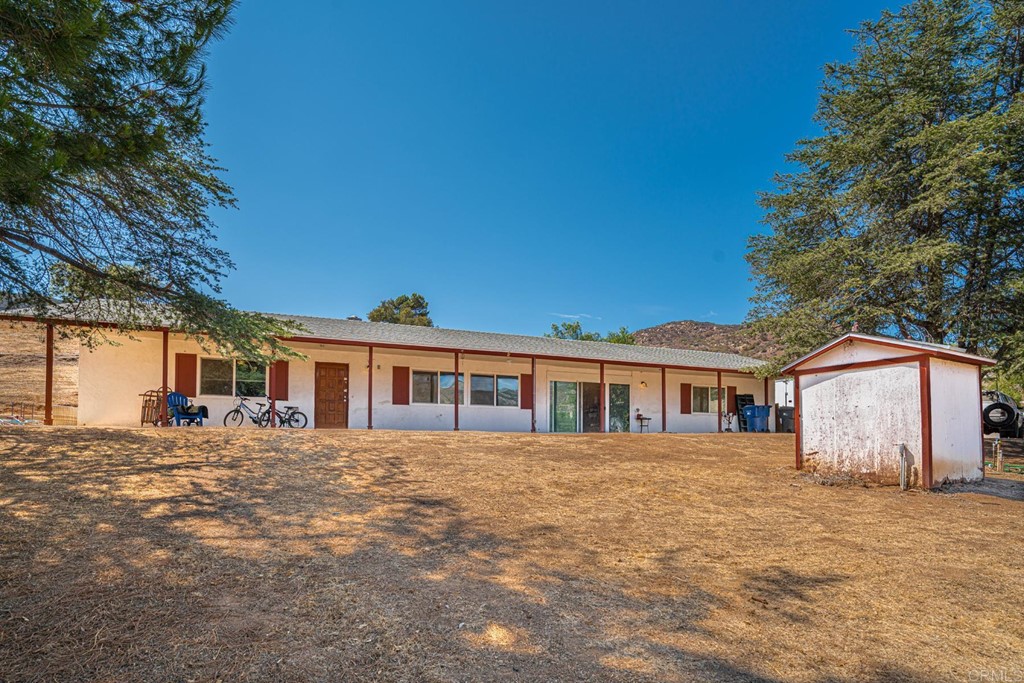 2030 Harbison Canyon Road El Cajon, CA 92019 - Photo 58 of 66 a front view of a house with a garden