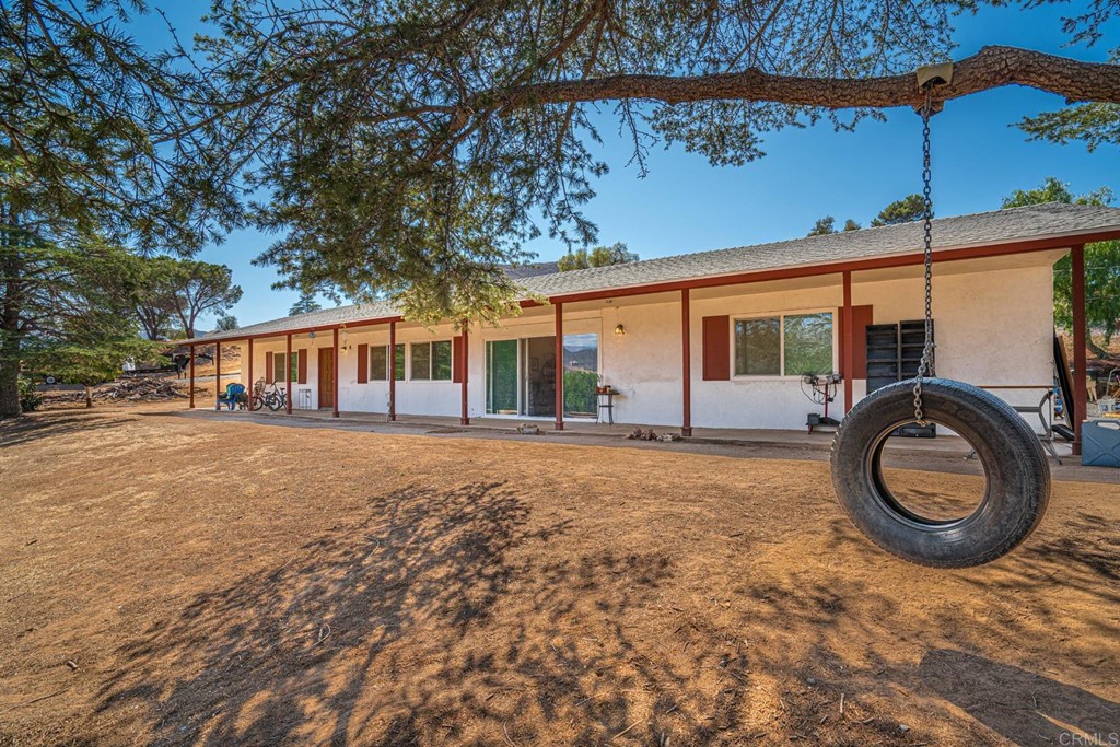 2030 Harbison Canyon Road El Cajon, CA 92019 - Photo 60 of 66 a front view of a house with garden