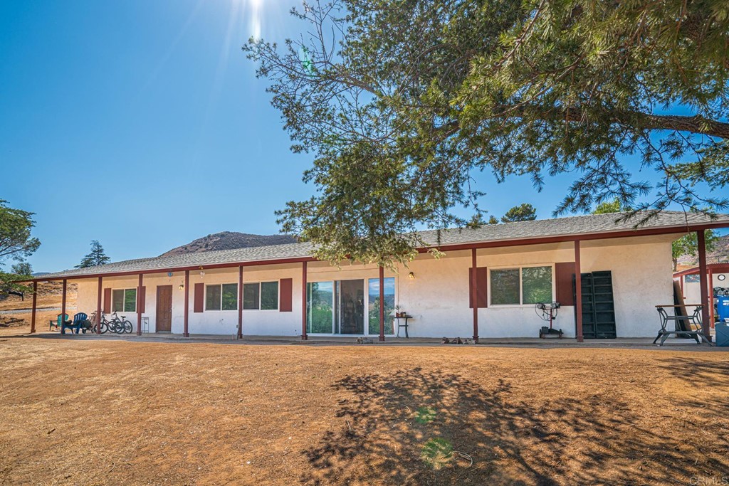 2030 Harbison Canyon Road El Cajon, CA 92019 - Photo 61 of 66 front view of a house with a yard