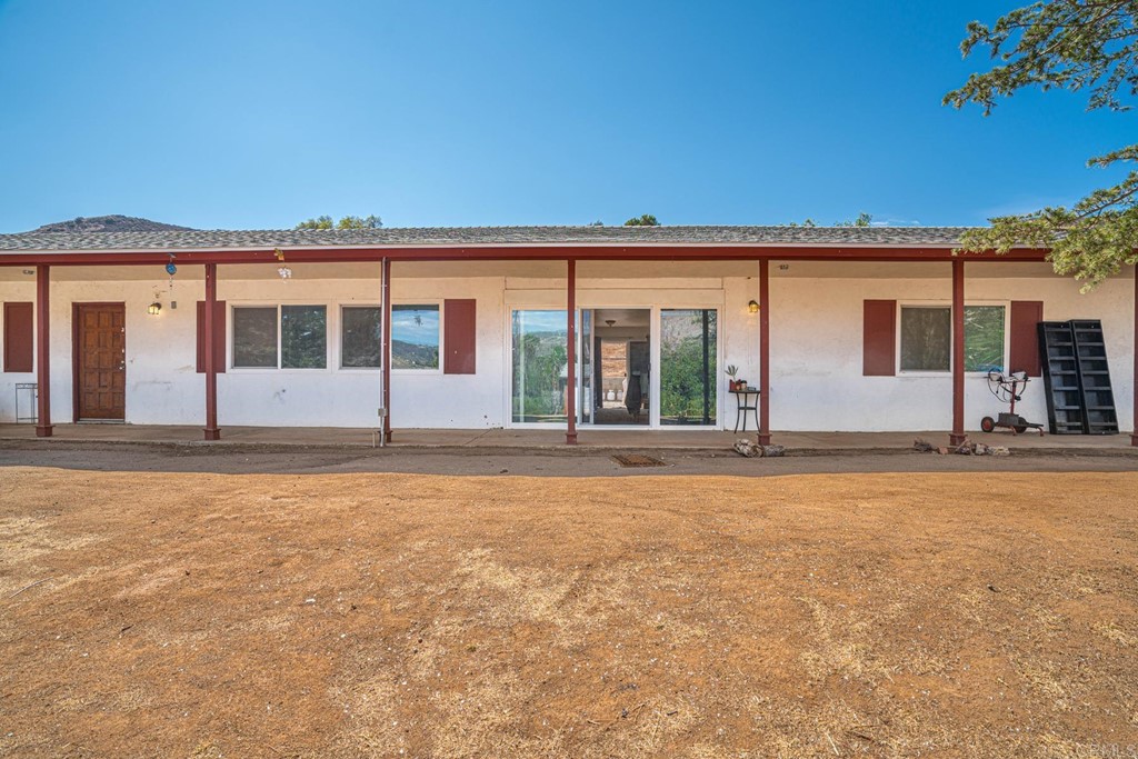2030 Harbison Canyon Road El Cajon, CA 92019 - Photo 62 of 66 front view of a house with a yard