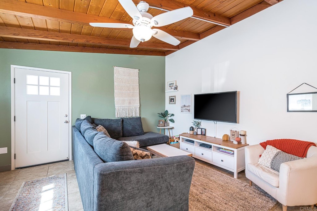 2030 Harbison Canyon Road El Cajon, CA 92019 - Photo 8 of 66 a living room with furniture and a flat screen tv