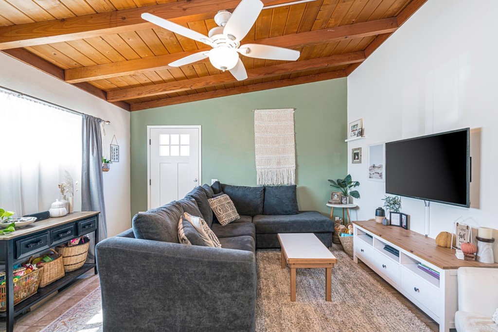 2030 Harbison Canyon Road El Cajon, CA 92019 - Photo 10 of 66 a living room with furniture and a flat screen tv