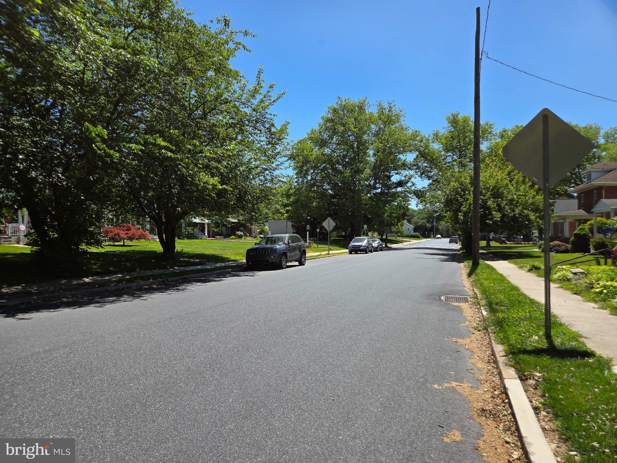 524 Locust Street Denver, PA 17517 - Photo 33 of 36 Sunny street lined with lush trees.