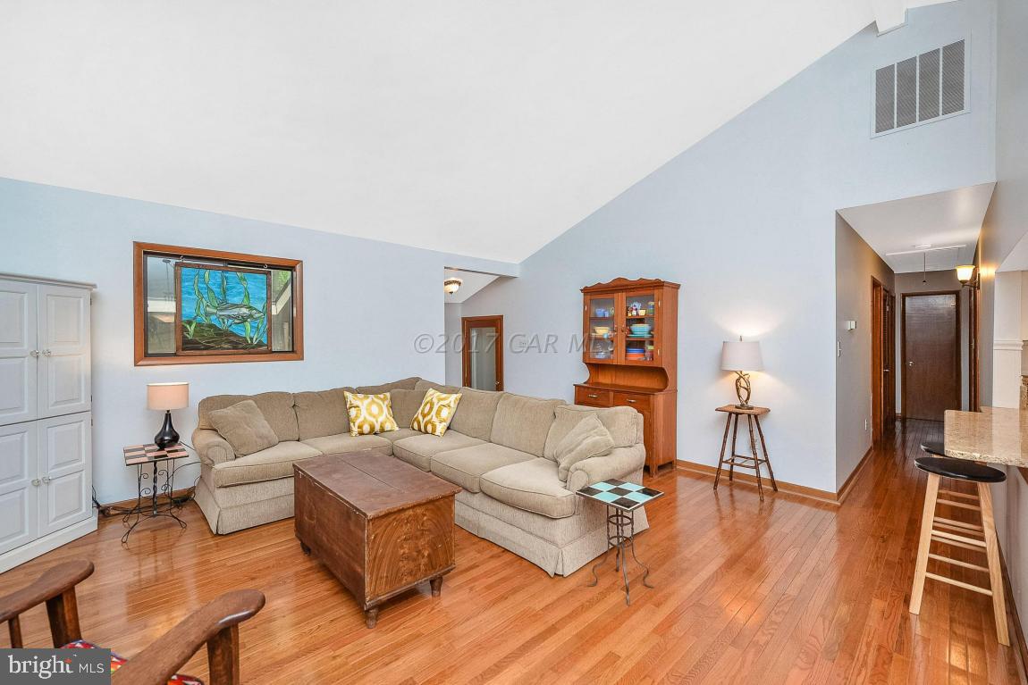 27 Brookside Road Ocean Pines, MD 21811 - Photo 12 of 44 a living room with furniture and a wooden floor