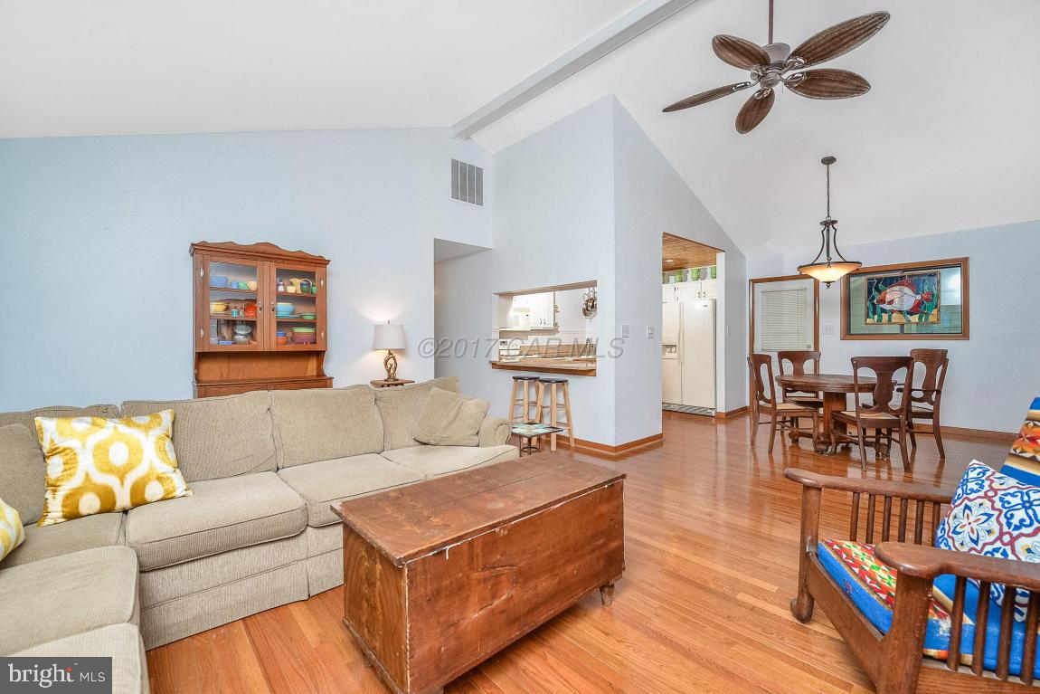 27 Brookside Road Ocean Pines, MD 21811 - Photo 13 of 44 a living room with furniture and a book shelf