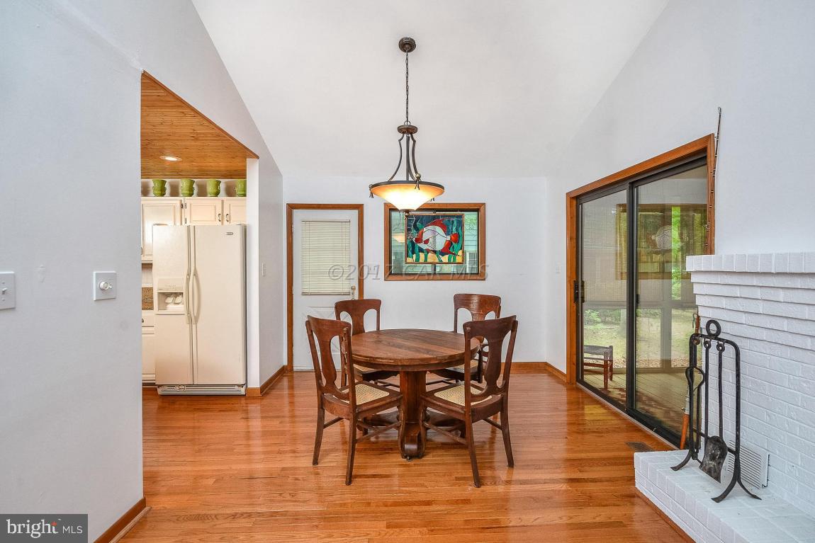 27 Brookside Road Ocean Pines, MD 21811 - Photo 15 of 44 a dining room with furniture window wooden floor