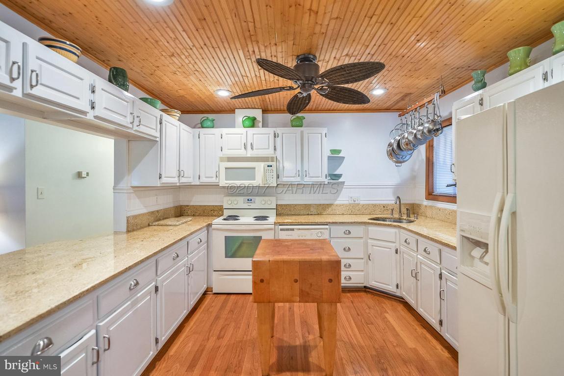 27 Brookside Road Ocean Pines, MD 21811 - Photo 17 of 44 a large kitchen with stainless steel appliances granite countertop a stove a sink dishwasher and a refrigerator