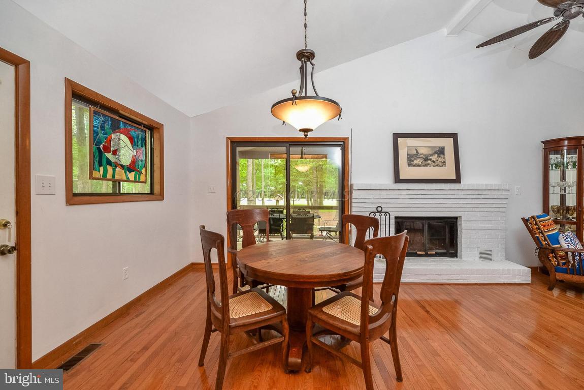 27 Brookside Road Ocean Pines, MD 21811 - Photo 21 of 44 a dining room with furniture a chandelier and wooden floor