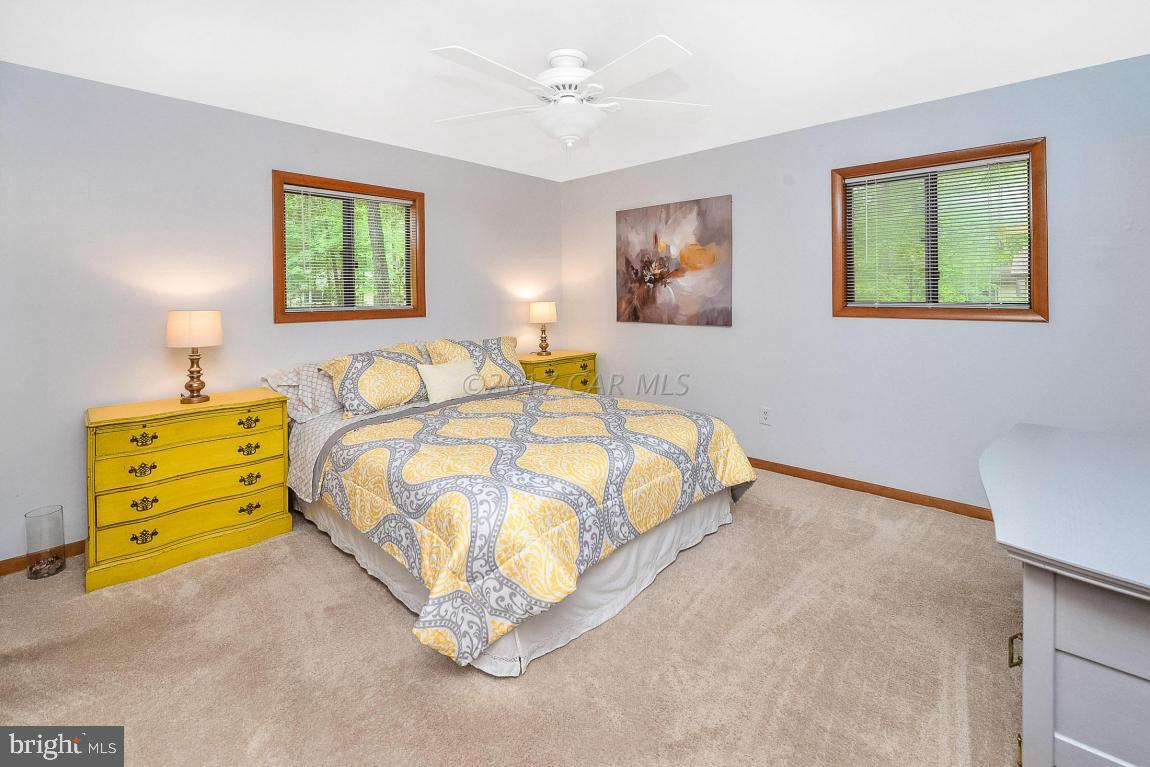 27 Brookside Road Ocean Pines, MD 21811 - Photo 22 of 44 a bedroom with a bed and a dresser
