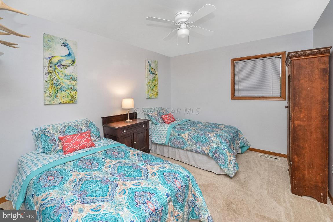 27 Brookside Road Ocean Pines, MD 21811 - Photo 27 of 44 a bedroom with two bed and a window