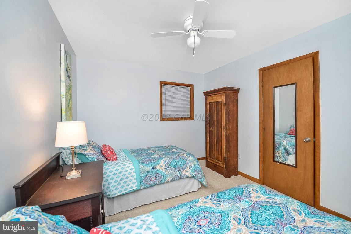 27 Brookside Road Ocean Pines, MD 21811 - Photo 28 of 44 a bedroom with furniture and a window