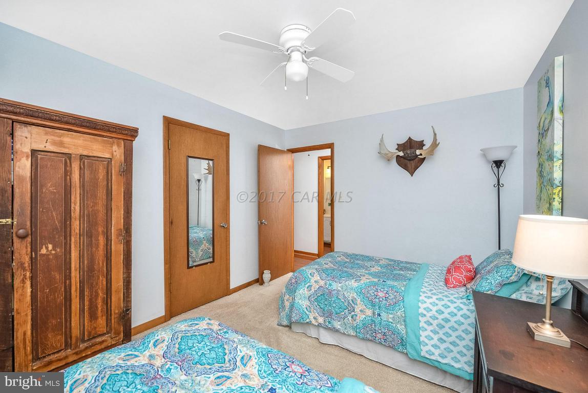 27 Brookside Road Ocean Pines, MD 21811 - Photo 29 of 44 a bedroom with furniture and a window