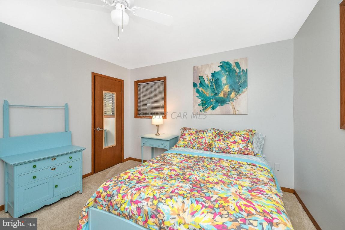 27 Brookside Road Ocean Pines, MD 21811 - Photo 33 of 44 a bedroom with a bed and a dresser in it
