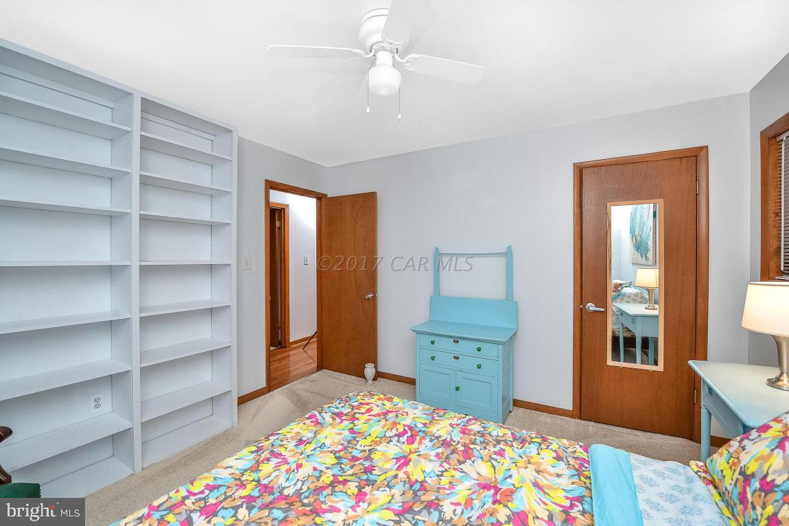 27 Brookside Road Ocean Pines, MD 21811 - Photo 34 of 44 a bedroom with a bed and a dresser in it