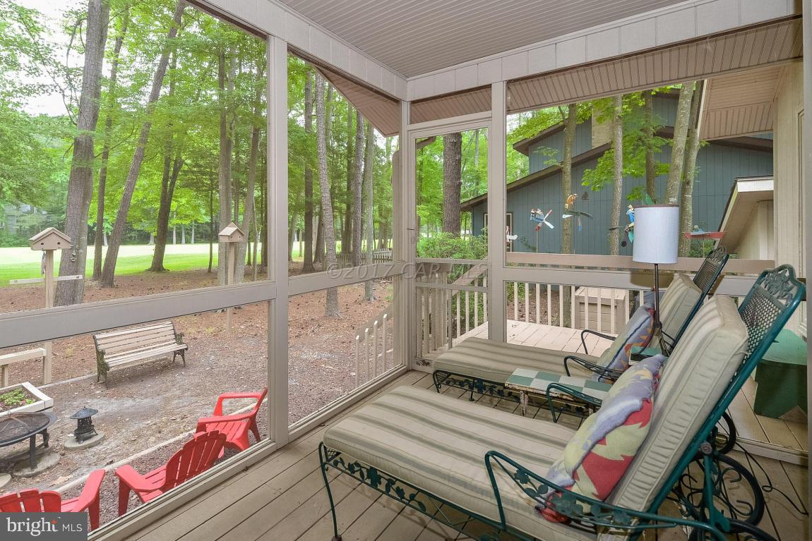 27 Brookside Road Ocean Pines, MD 21811 - Photo 36 of 44 a view of balcony with wooden floor and outdoor seating