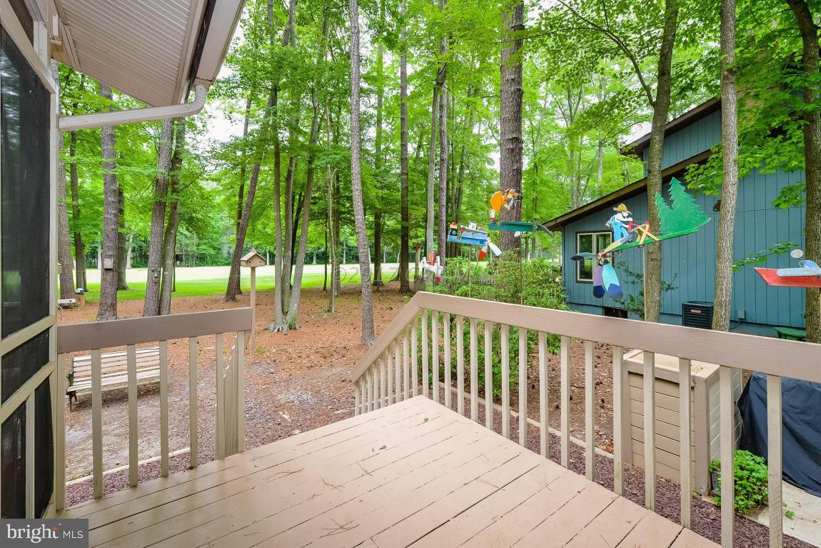 27 Brookside Road Ocean Pines, MD 21811 - Photo 39 of 44 a balcony with trees in front of it