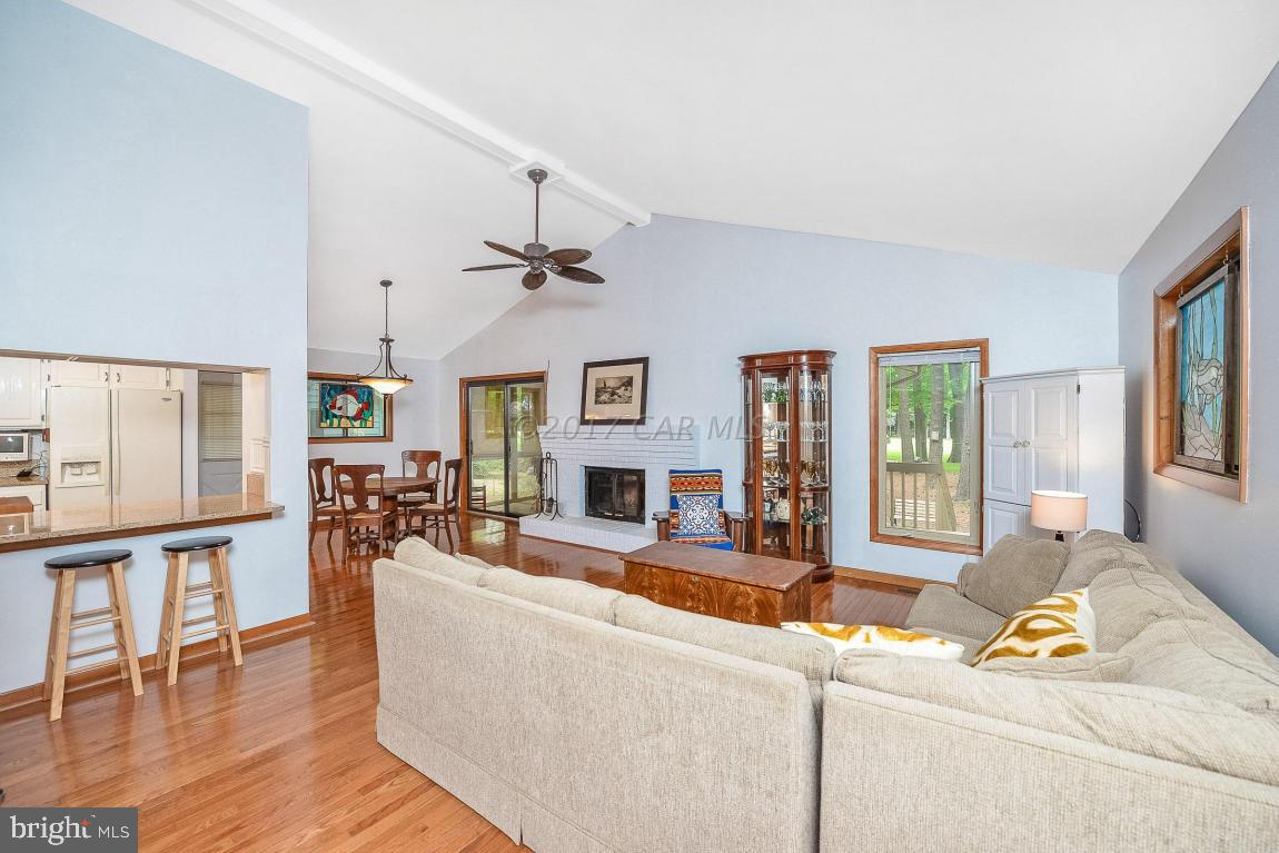 27 Brookside Road Ocean Pines, MD 21811 - Photo 5 of 44 a living room with furniture wooden floor and a large window