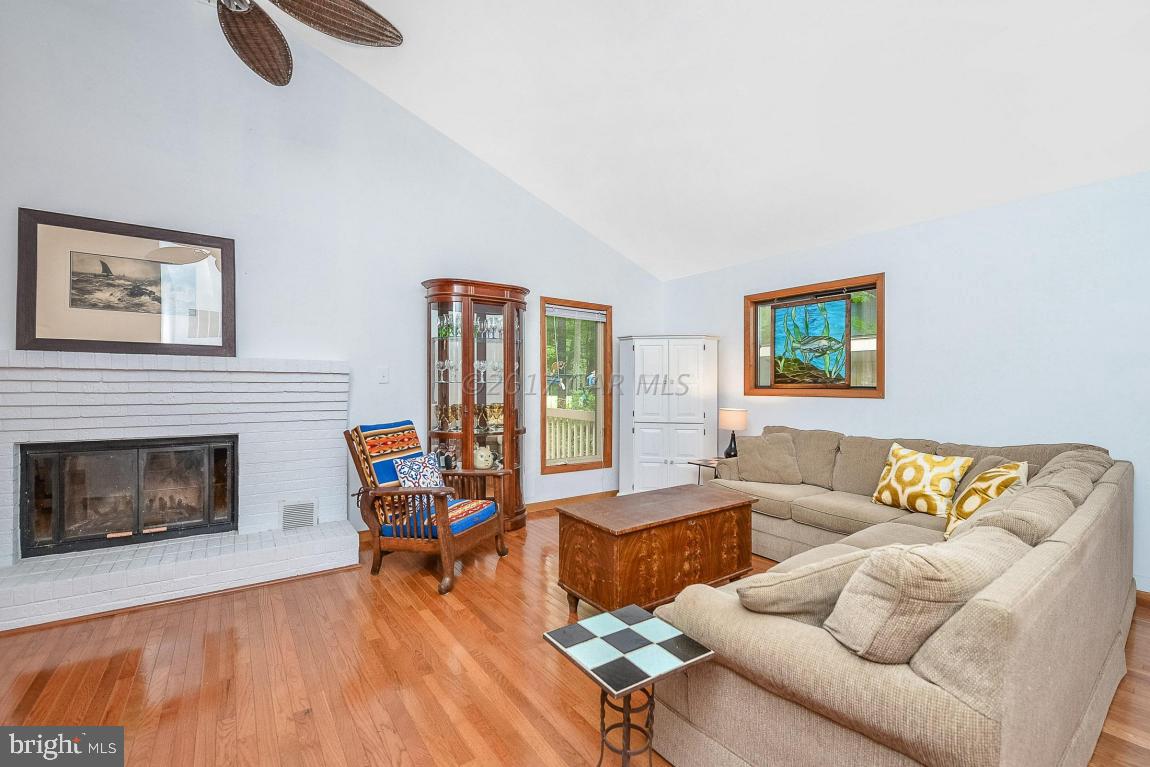 27 Brookside Road Ocean Pines, MD 21811 - Photo 7 of 44 a living room with furniture and a fireplace