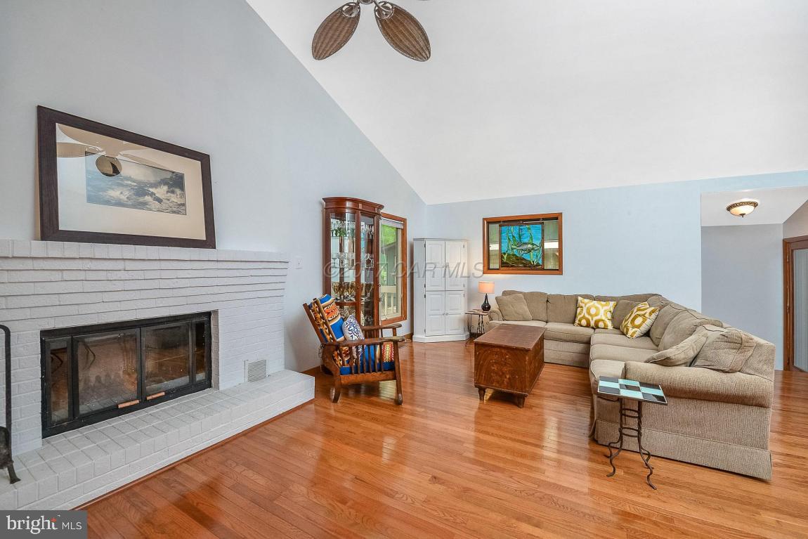 27 Brookside Road Ocean Pines, MD 21811 - Photo 9 of 44 a living room with furniture and a fireplace