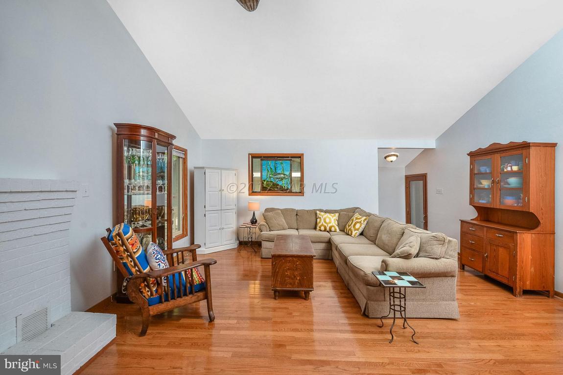 27 Brookside Road Ocean Pines, MD 21811 - Photo 10 of 44 a living room with furniture or couch and a wooden floor