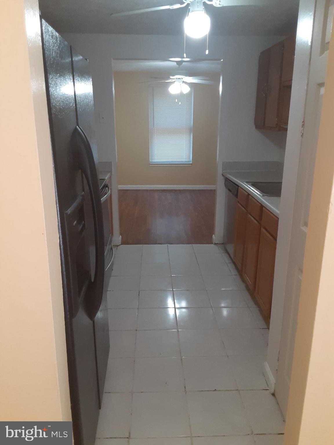 4803 Hawksbury Road Baltimore, MD 21208 - Photo 19 of 19 Looking through the main level kitchen from DR
