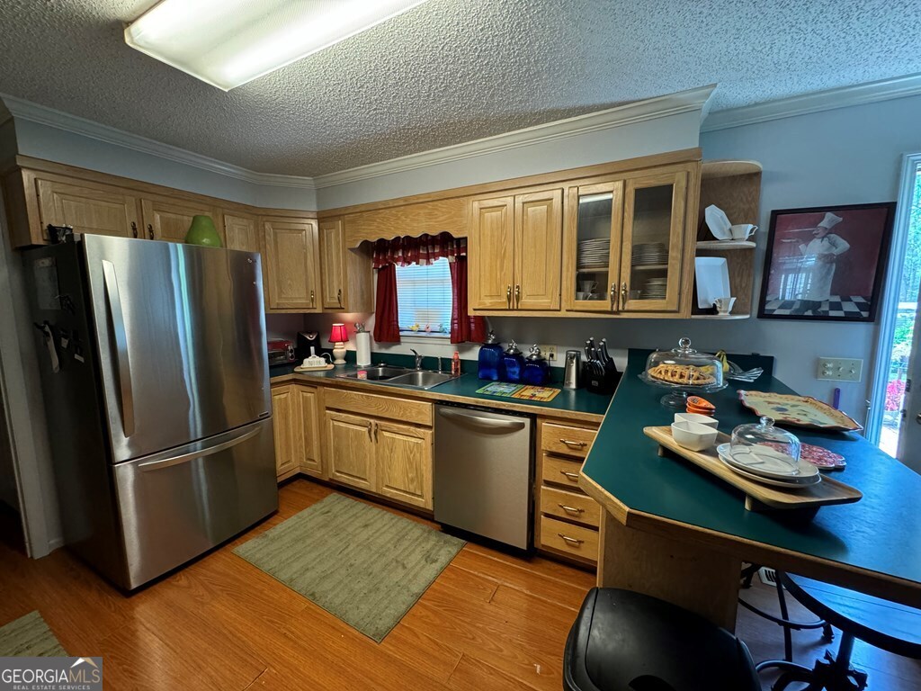 2014 Davis Avenue Tifton, GA 31794 - Photo 12 of 18 a kitchen with stainless steel appliances granite countertop a refrigerator sink and cabinets