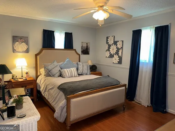 a bed room with a bed and a chandelier