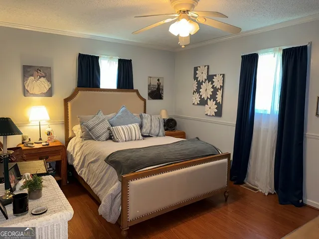 a bed room with a bed and a chandelier