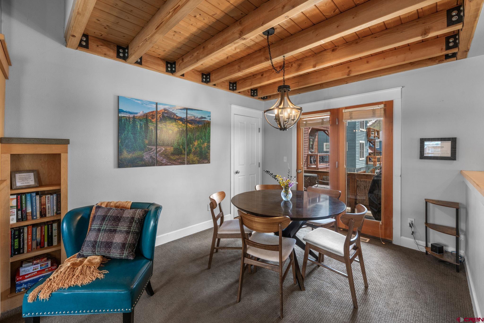 205 Horseshoe Crested Butte, CO 81225 - Photo 11 of 28 a dining room with furniture and rug