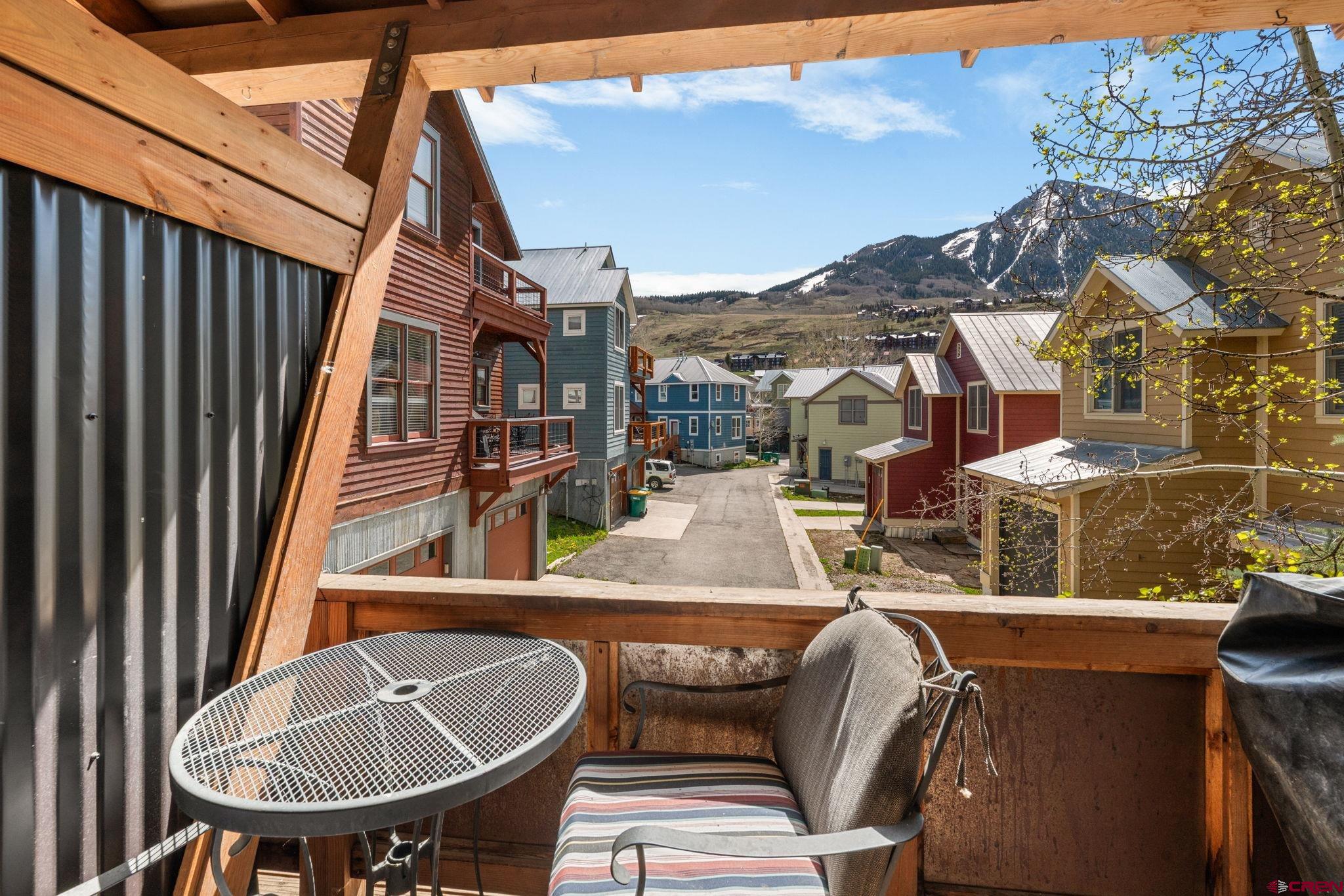 205 Horseshoe Crested Butte, CO 81225 - Photo 12 of 28 a view of a balcony dining area and chandelier
