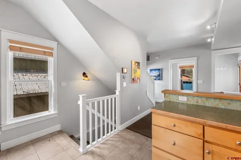 a view of living room kitchen with furniture and fireplace