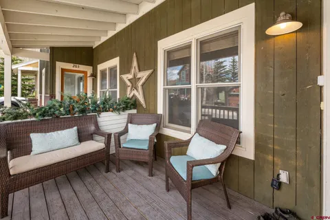 a outdoor living space with furniture and a potted plant