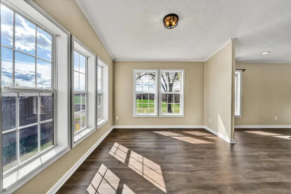 a view of a entryway door with wooden floor