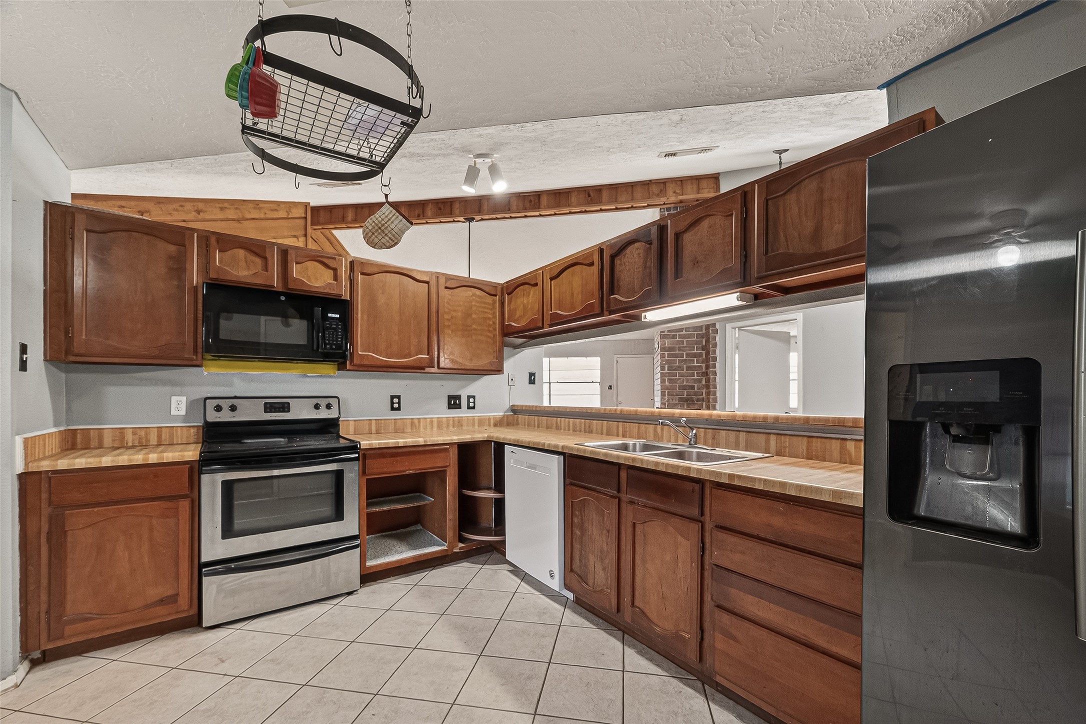 10135 Shell Rock Road La Porte, TX 77571 - Photo 7 of 17 a kitchen with stainless steel appliances granite countertop a stove and a microwave