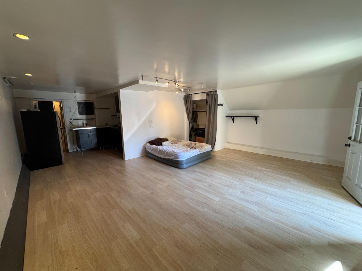 370 Bartlett Street, Unit 3 San Francisco, CA 94110 - Photo 32 of 35 a view of a storage & utility room with refrigerator