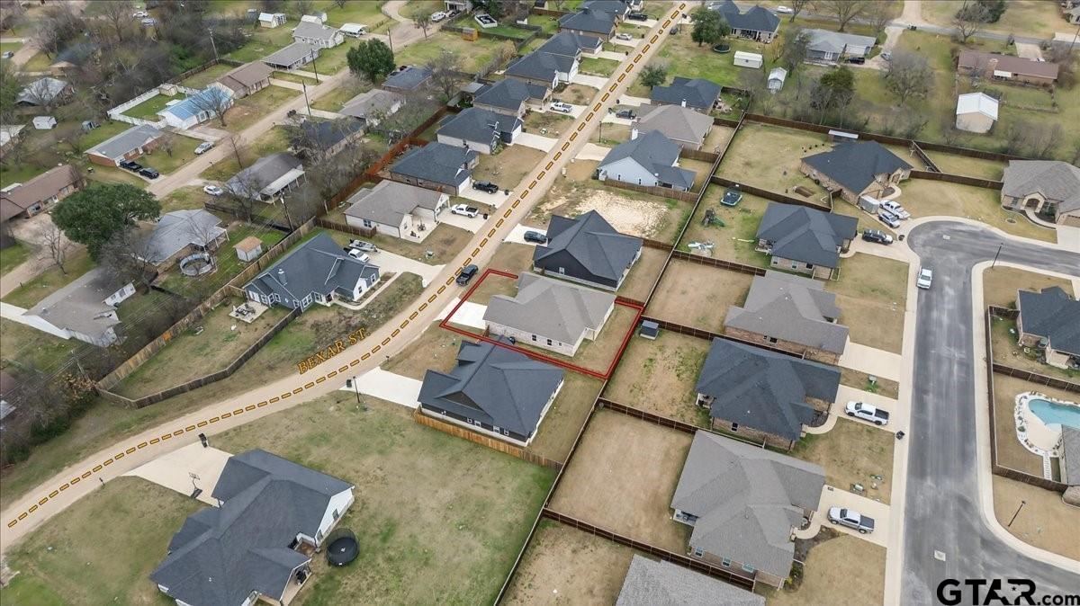 117 Bexar Mabank, TX 75147 - Photo 16 of 19 an aerial view of residential building with parking