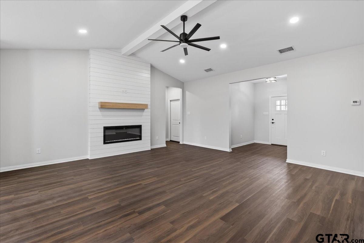 117 Bexar Mabank, TX 75147 - Photo 7 of 19 an empty room with wooden floor and ceiling fan
