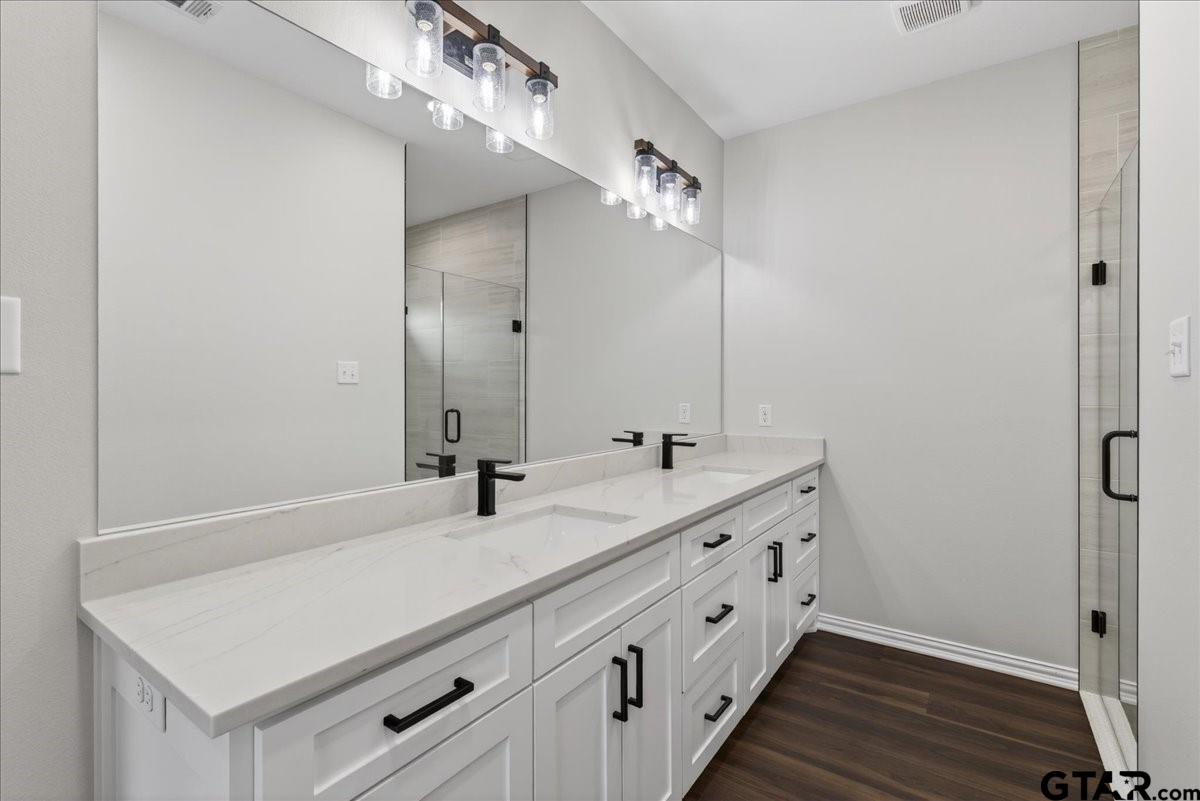 117 Bexar Mabank, TX 75147 - Photo 8 of 19 a bathroom with a double vanity sink and mirror
