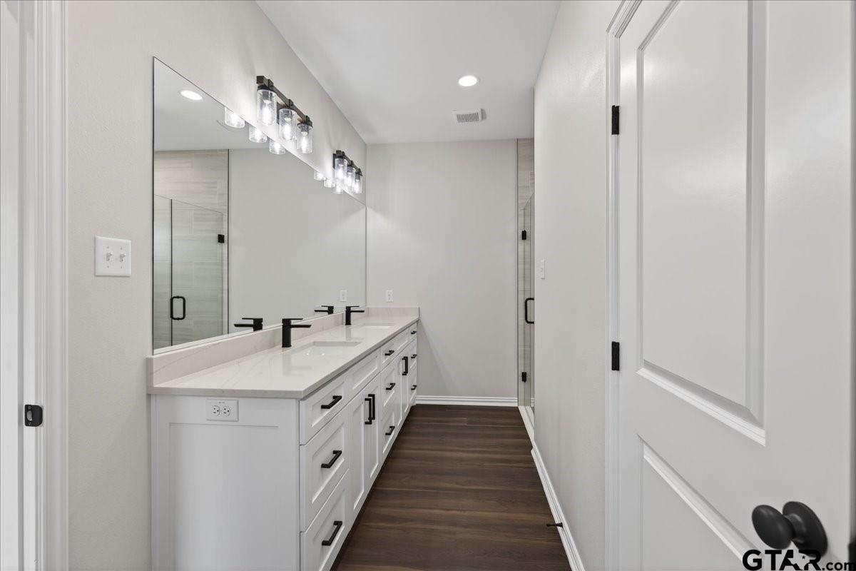 117 Bexar Mabank, TX 75147 - Photo 9 of 19 a spacious bathroom with double vanity and mirrors