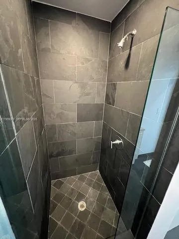 a kitchen with stainless steel appliances a stove a microwave and sink