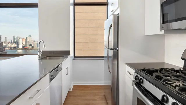 a kitchen with a stove and a refrigerator