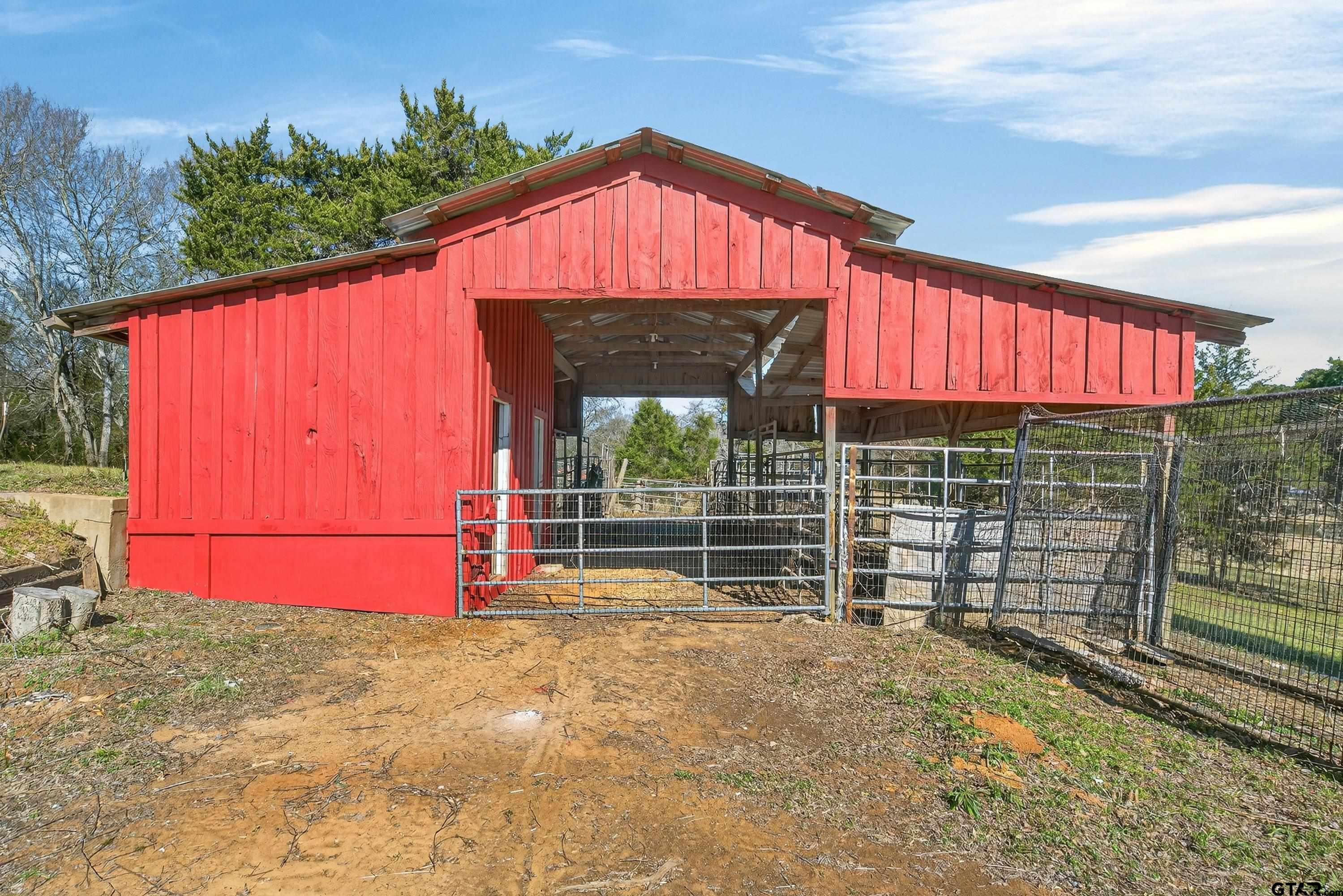 10418 East Fm 2011 Longview, TX 75603 - Photo 13 of 45 a view of a wooden door with a yard