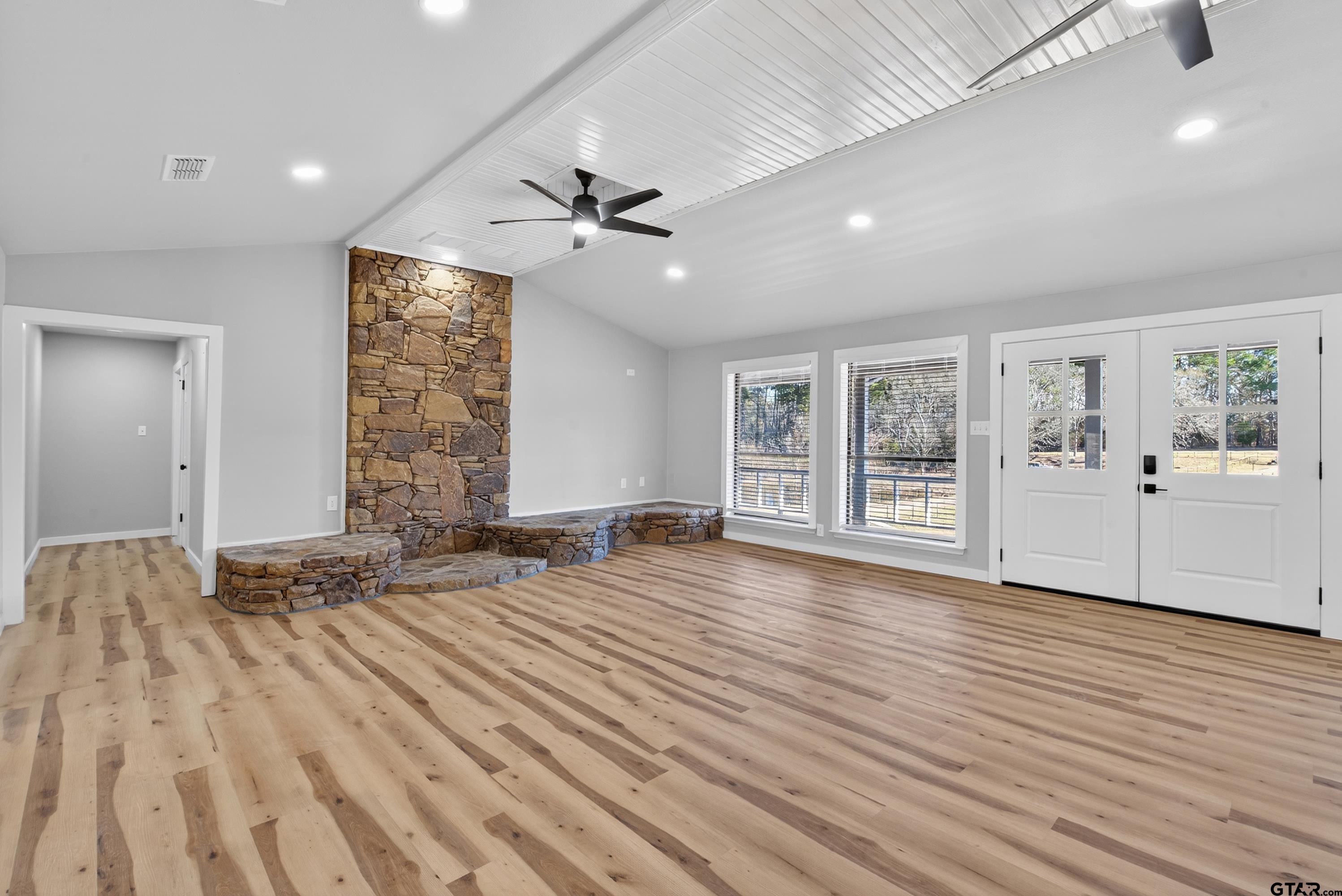 10418 East Fm 2011 Longview, TX 75603 - Photo 20 of 45 a view of an empty room with wooden floor and a window