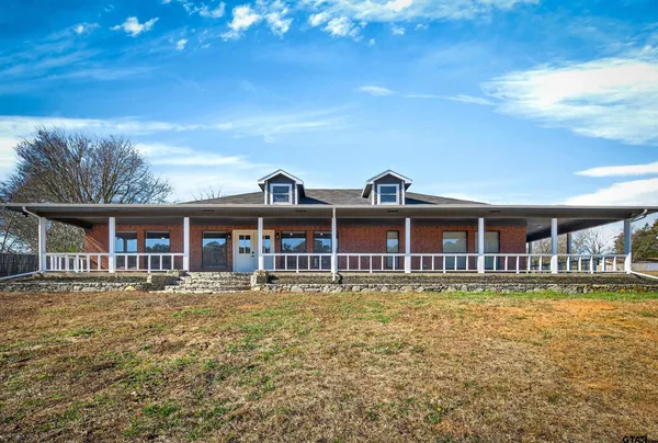 a view of a large body of water with a building in the background