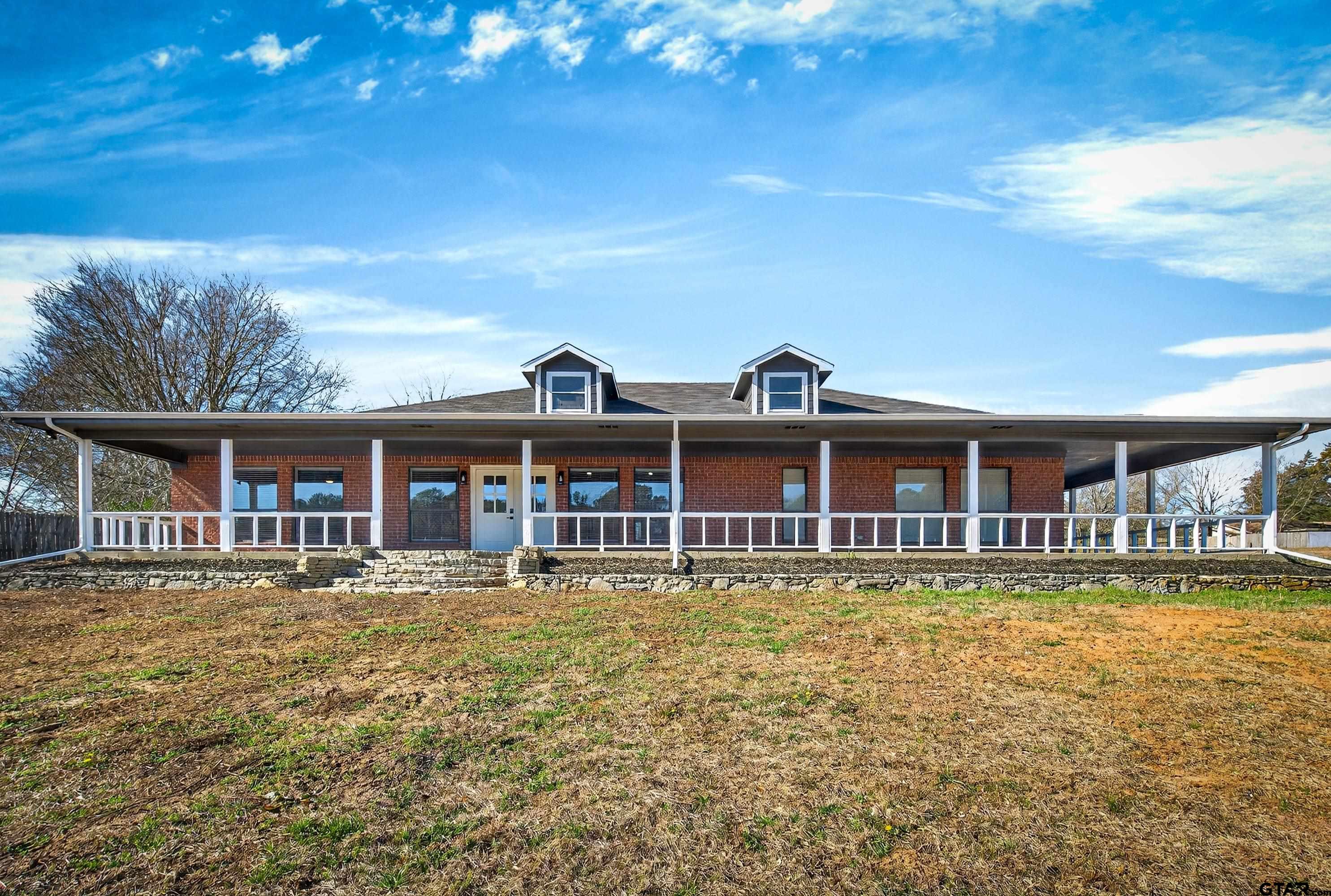 10418 East Fm 2011 Longview, TX 75603 - Photo 2 of 45 a view of a large body of water with a building in the background