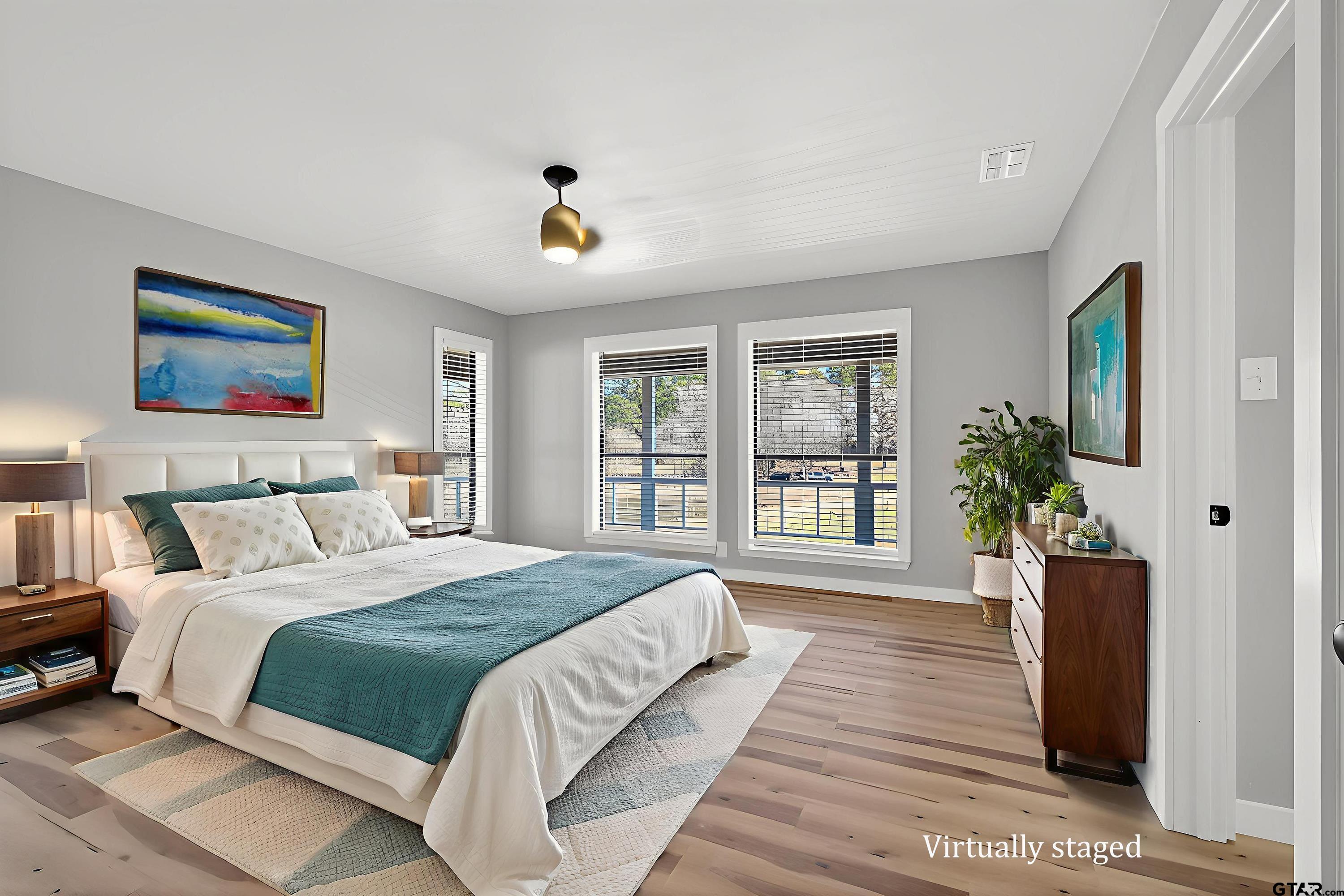 10418 East Fm 2011 Longview, TX 75603 - Photo 32 of 45 a spacious bedroom with a large bed and a window