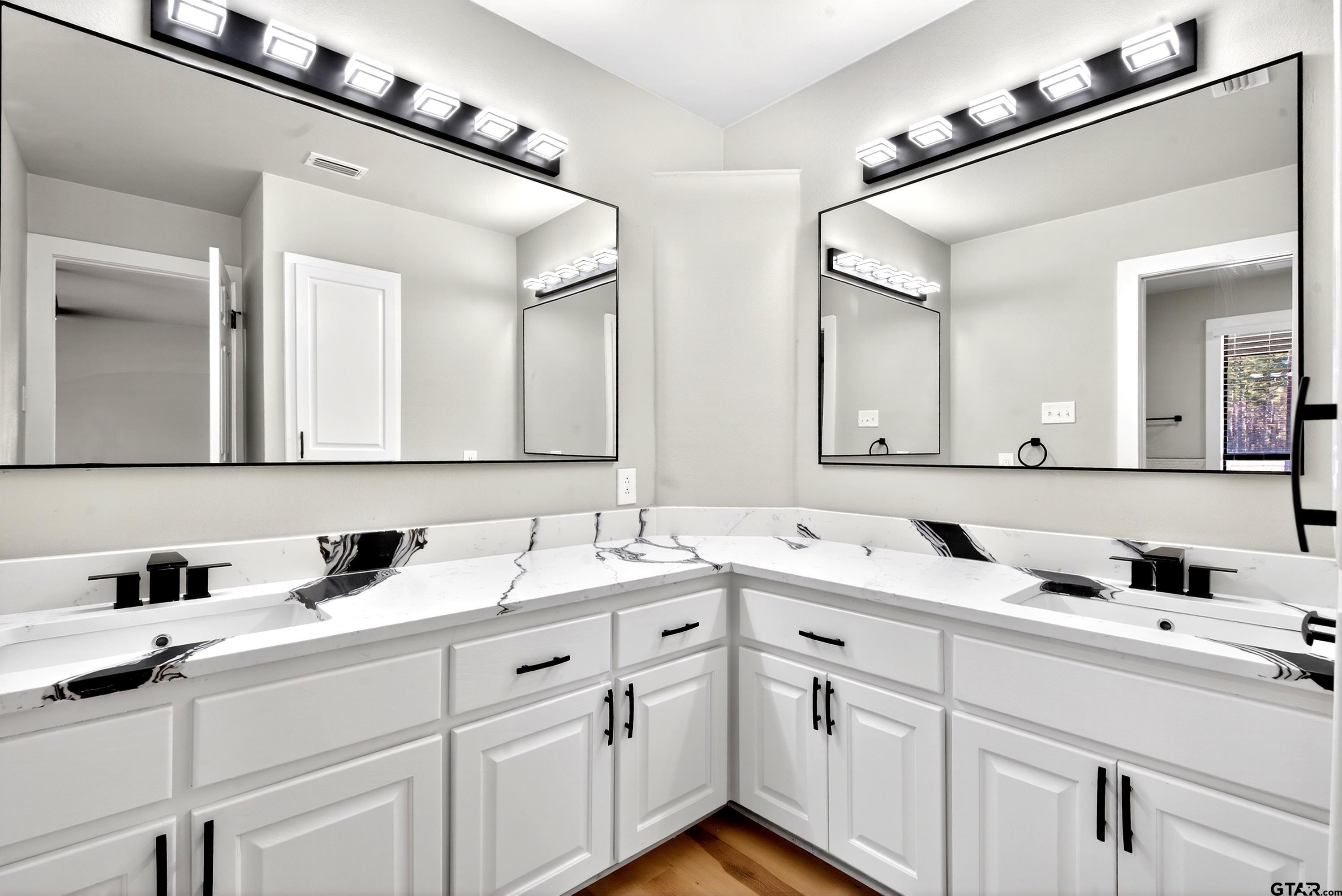 10418 East Fm 2011 Longview, TX 75603 - Photo 33 of 45 a bathroom with a sink and a mirror