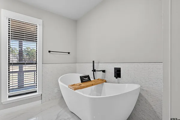 a bathroom with a shower and a shower