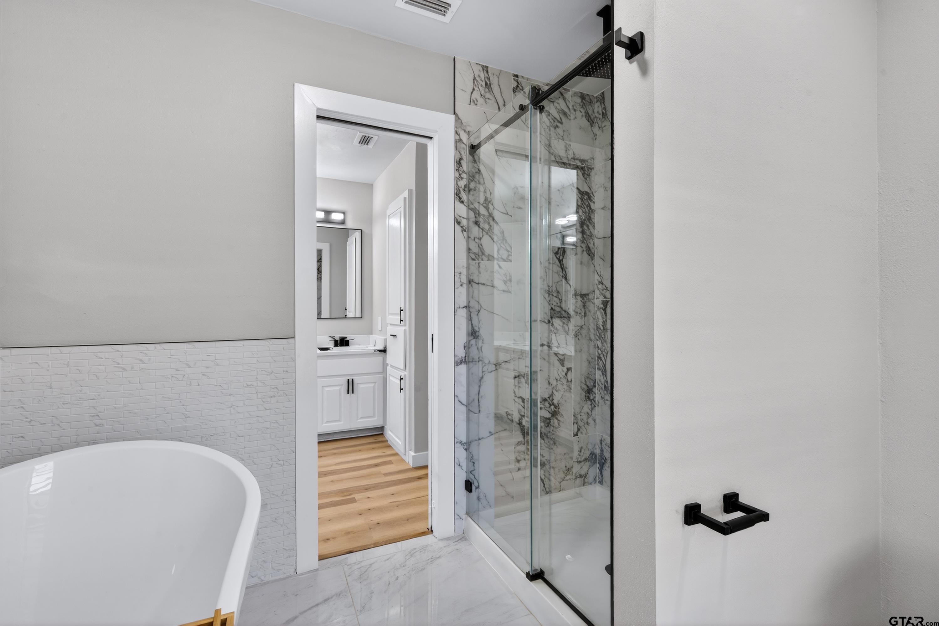 10418 East Fm 2011 Longview, TX 75603 - Photo 36 of 45 a bathroom with a bathtub and shower