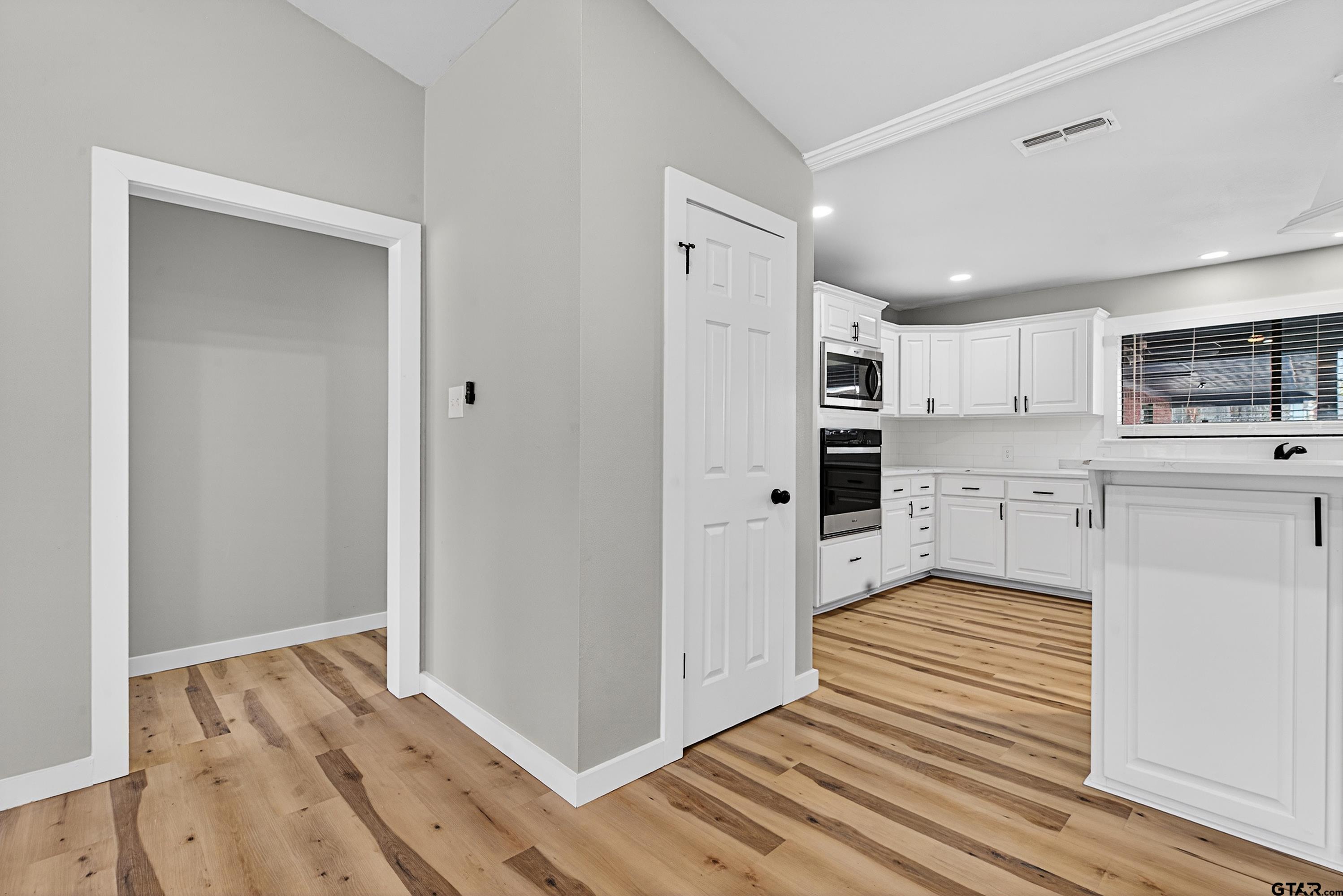 10418 East Fm 2011 Longview, TX 75603 - Photo 37 of 45 a kitchen with a refrigerator and window